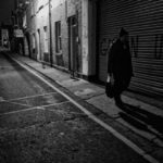 Denis walks the streets of Dublin at night