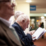 Man checks the results of the greyhound races