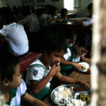 Children eat a meal in Yeik Mon orphanage. Mandalay, Myanmar