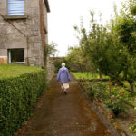 Sister walks through the convent garden