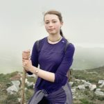 Portrait of Croagh Patrick young female pilgrim with a stick