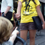 Girl points with her finger at the Amnesty International volunteer