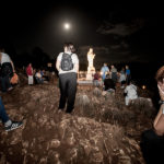 People pray at nighttime at the Medjugorje pilgrimage site