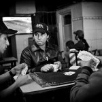 Teenagers play cards in Tunis café