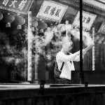 Woman holds the incense sticks in China