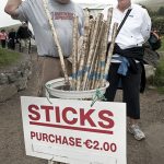 Man and woman are choosing stick for Croagh Patrick pilgrimage