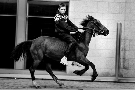 Teenage bareback rider on the street of Dublin