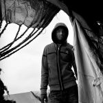 Refugee entering the tent, Choucha refugee camp, Tunisia